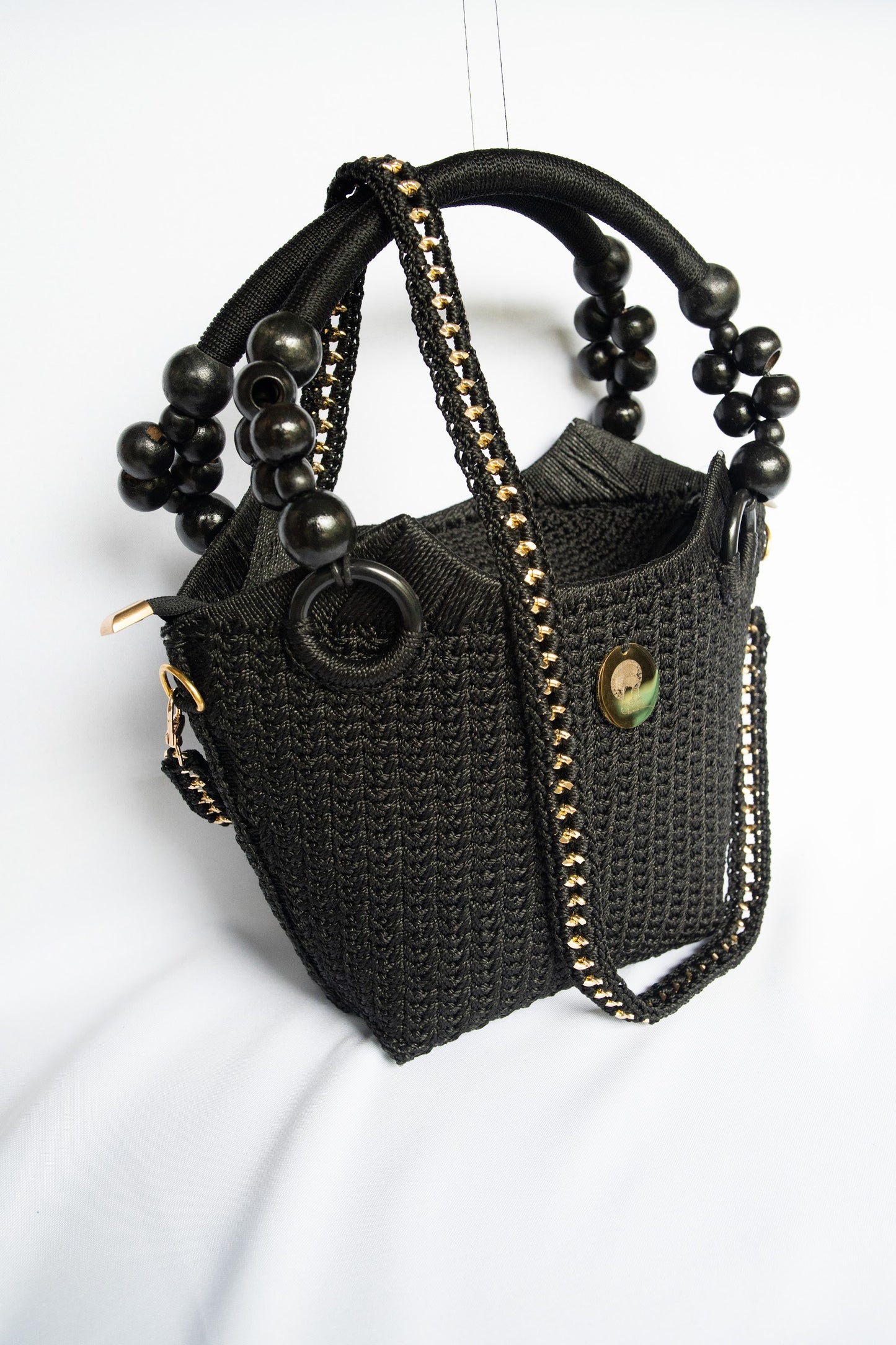 Black Elegant handcrafted woven, crotchet handbag with Bag a strap, wooden handles & African-inspired design by SINORA