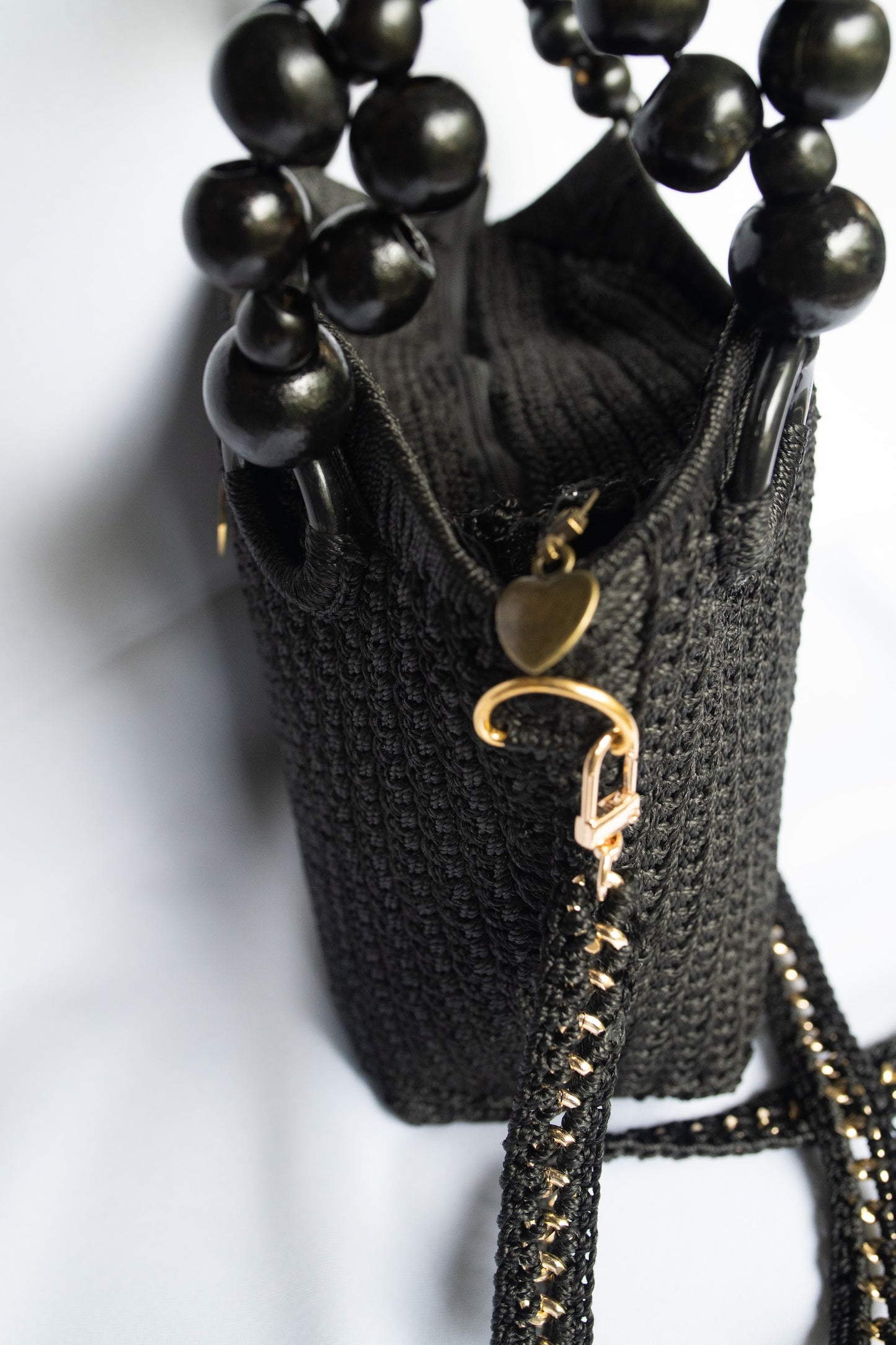 Black Elegant handcrafted woven, crotchet handbag with Bag a strap, wooden handles & African-inspired design by SINORA