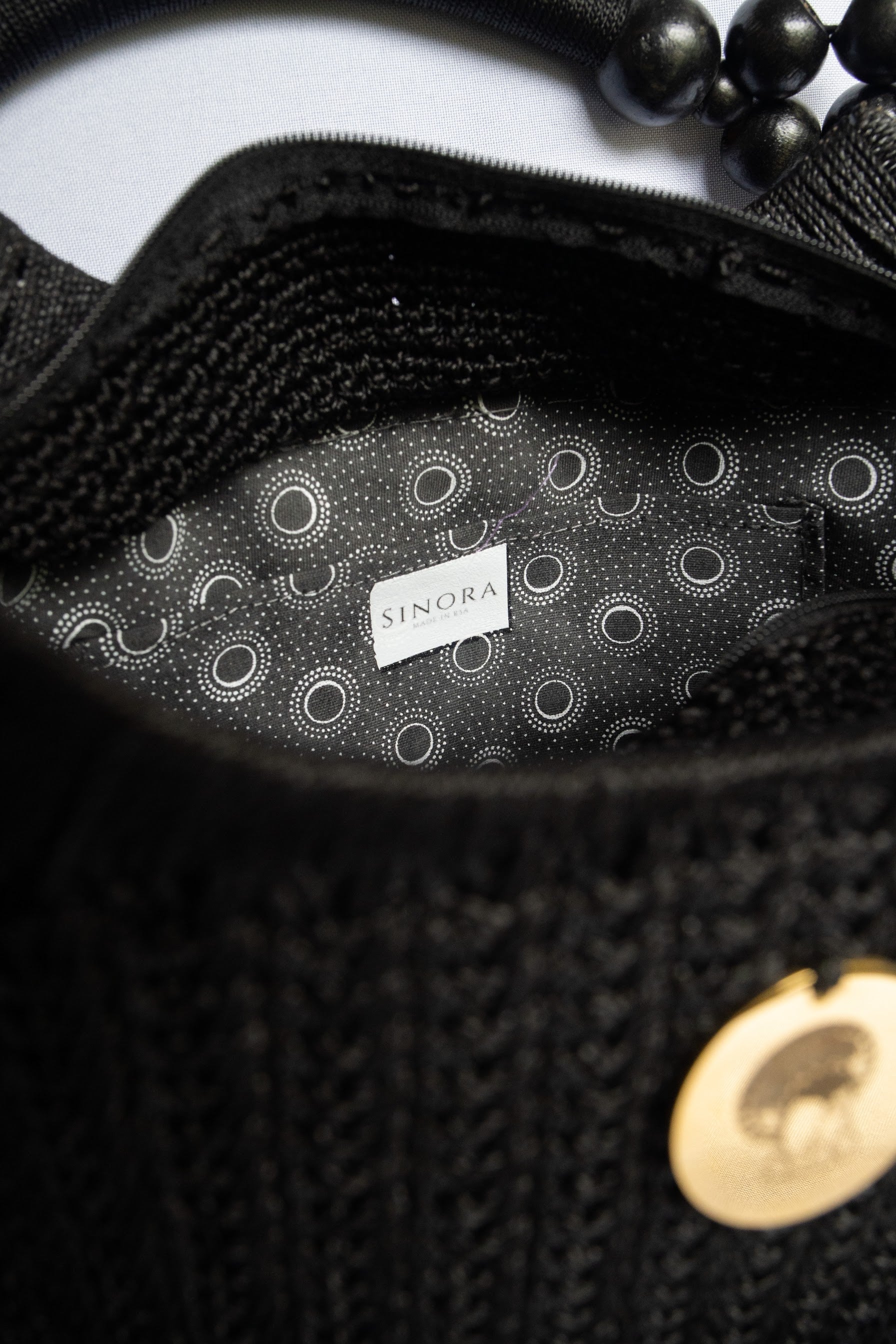 Black Elegant handcrafted woven, crotchet handbag with Bag a strap, wooden handles & African-inspired design by SINORA