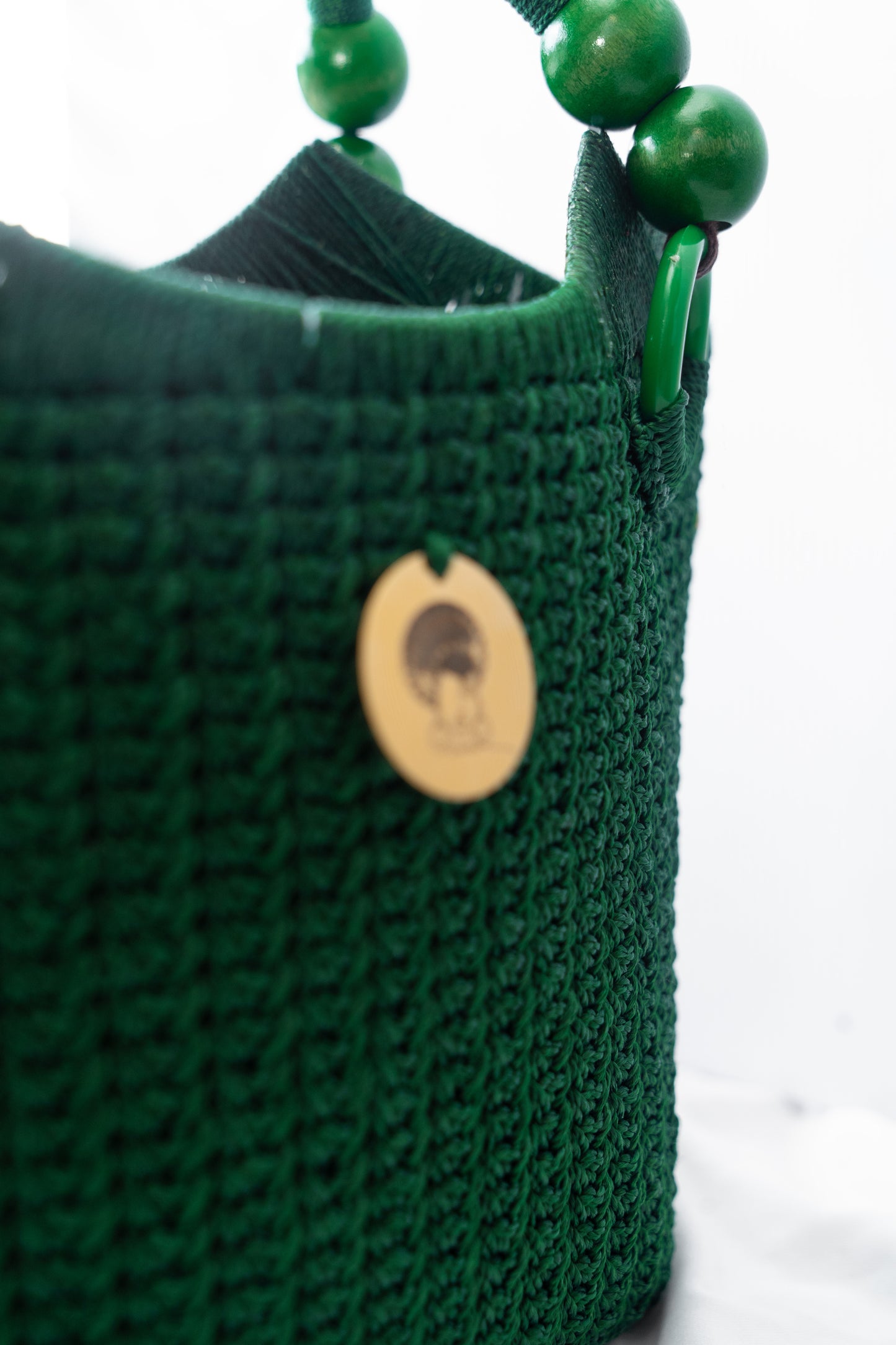 Green Elegant handcrafted woven, crotchet handbag with Bag a strap, wooden handles & African-inspired design by SINORA