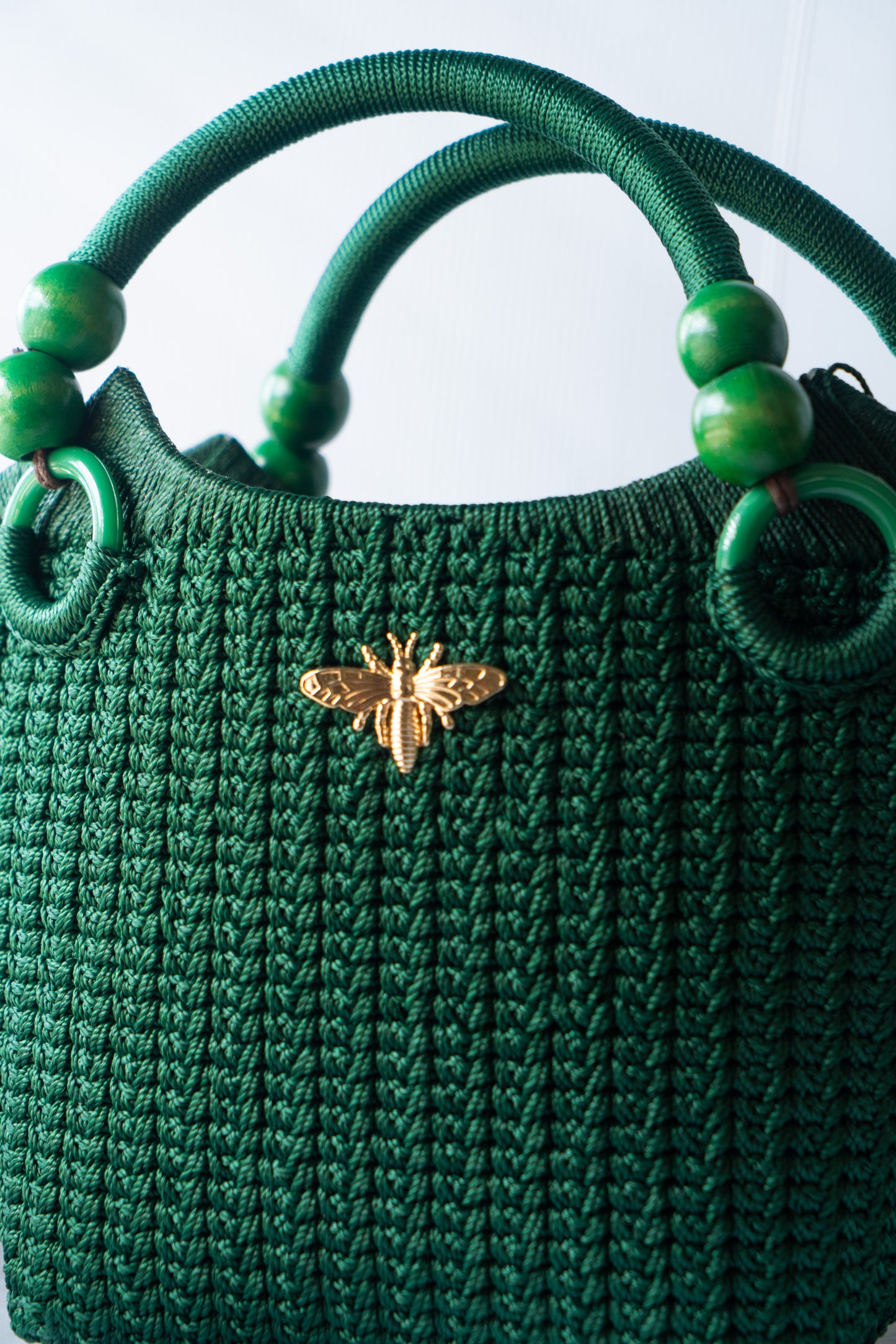 Green Elegant handcrafted woven, crotchet handbag with Bag a strap, wooden handles & African-inspired design by SINORA