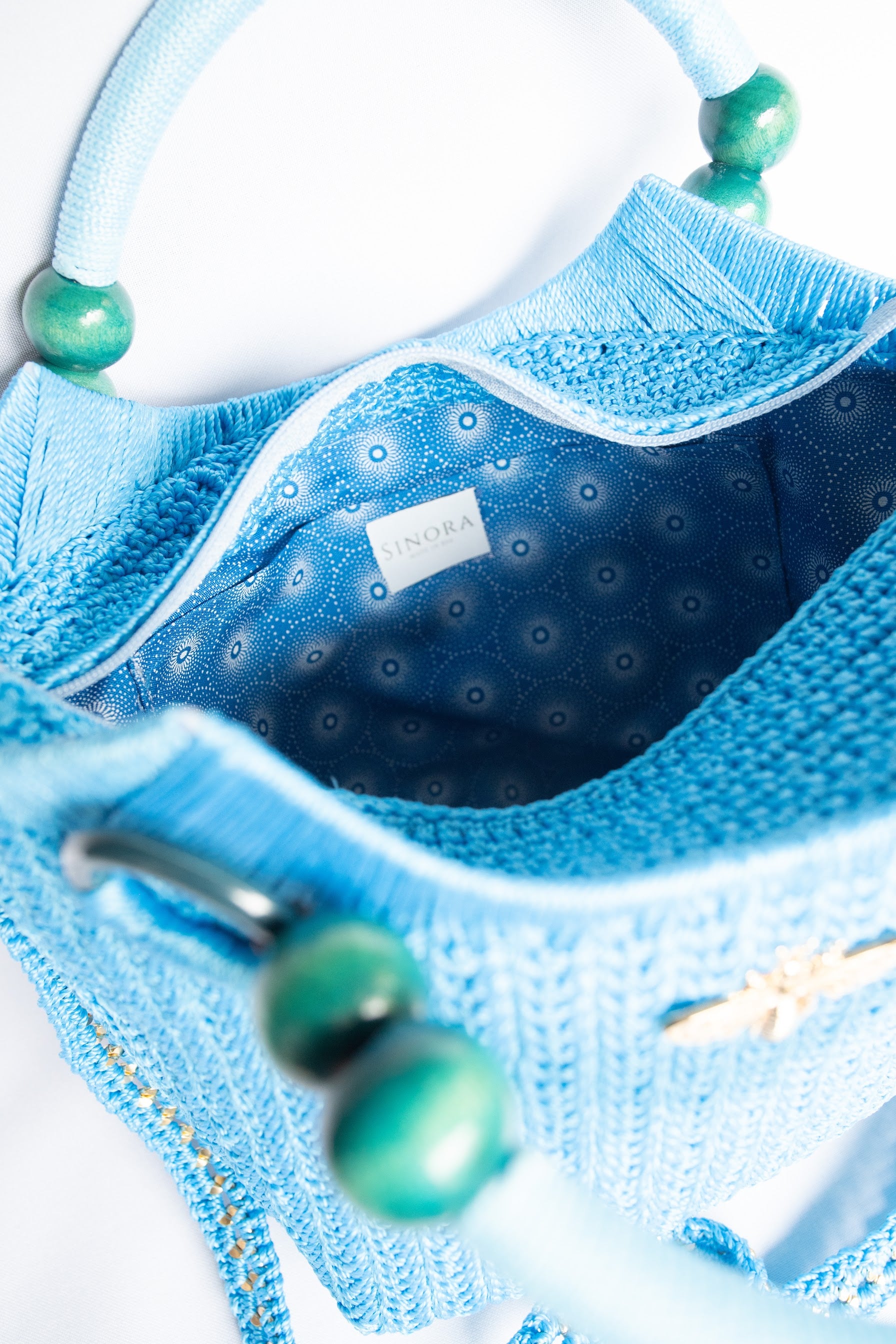 Blue light blue Elegant handcrafted woven, crotchet handbag with Bag a strap, wooden handles & African-inspired design by SINORA 
