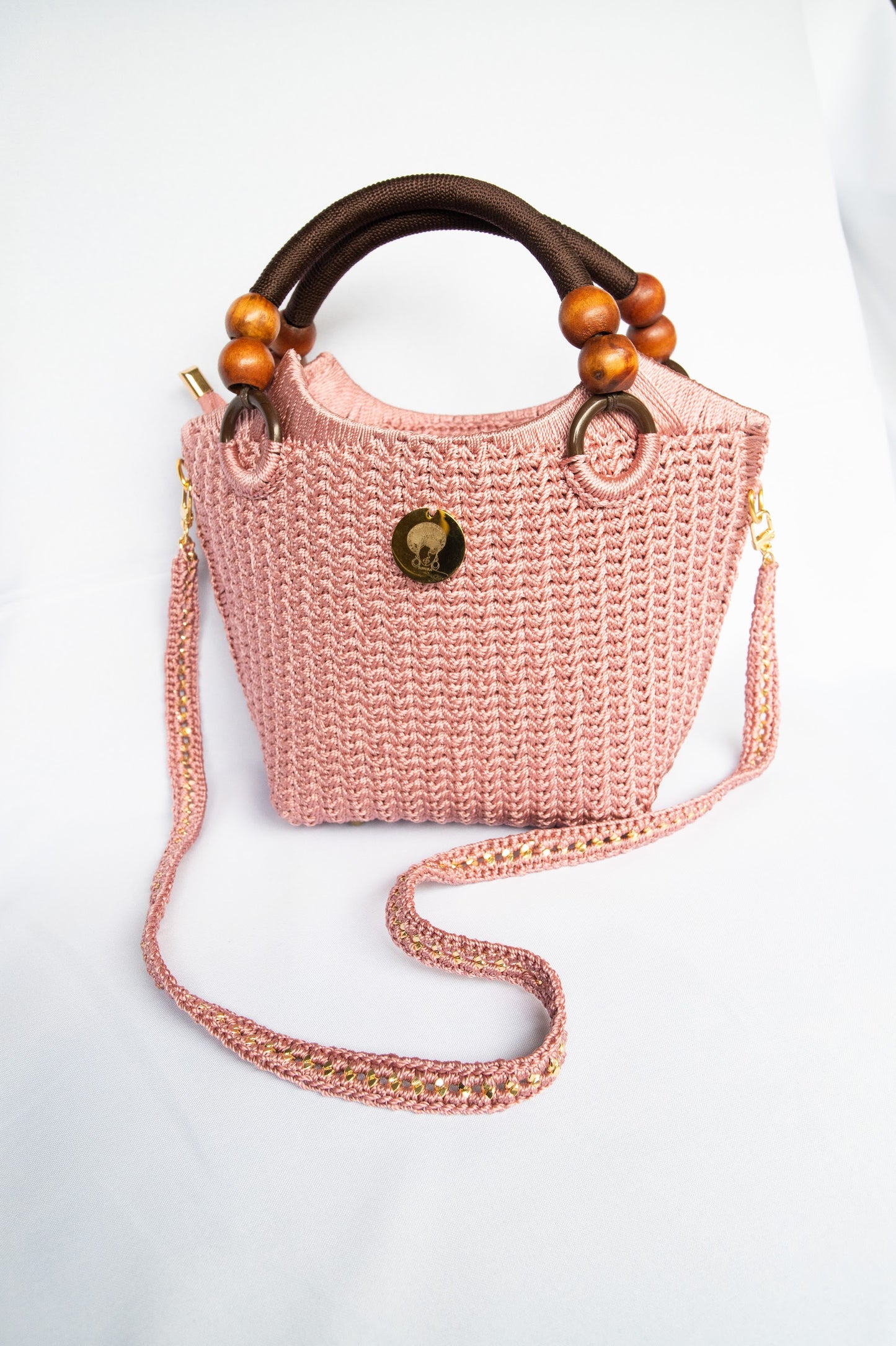 Pink dusty pink Elegant handcrafted woven, crotchet handbag with Bag a strap, wooden handles & African-inspired design by SINORA 